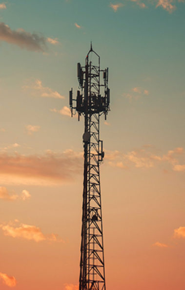 Sunrise and telecom pole